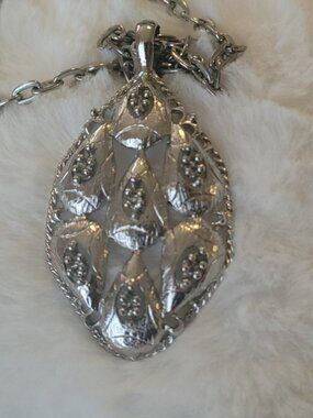 Necklace with pendant.